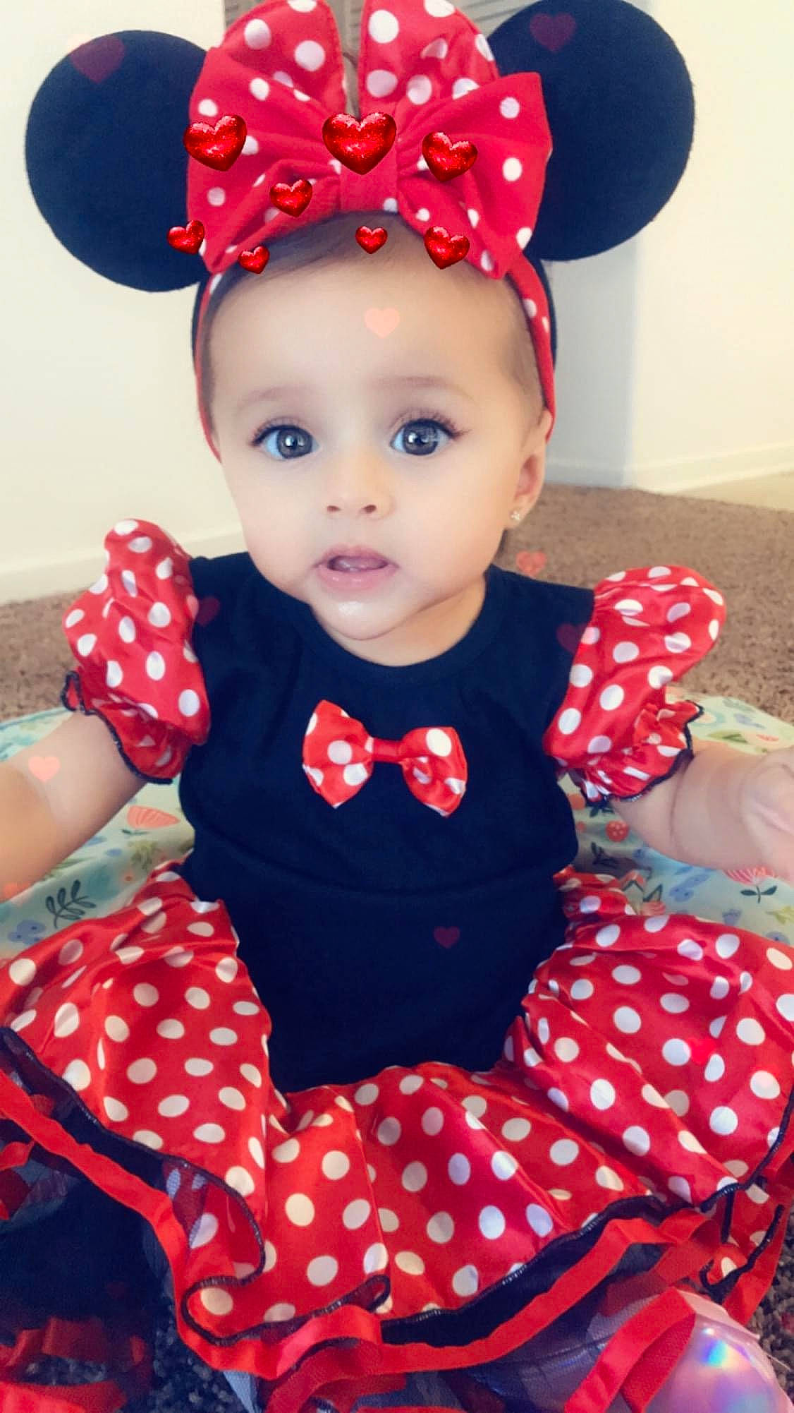 Jakayla is registered to the contest to win money with this photo: baby_toddler_clothing, beauty, blue, cap, child, clothing, costume_hat, hat, head, headgear, headpiece, lip, one_piece_garment, pattern, person, pink, red, sleeve, textile, toddler