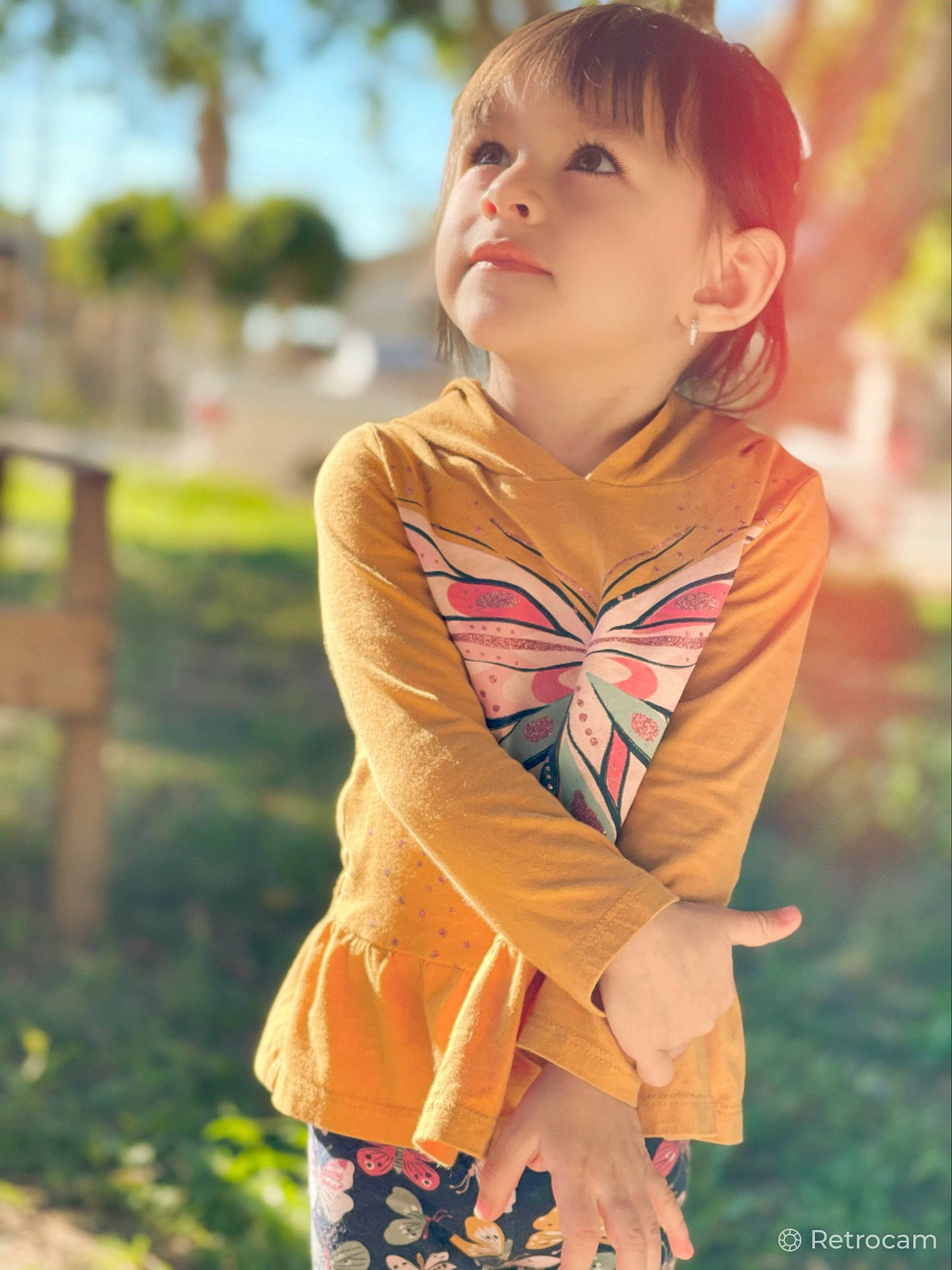 Jakayla joined the competition — help win amazing prizes! brown_hair, child, dress, eye, face, fun, grass, hair, happy, head, iris, jewellery, leisure, orange, people_in_nature, person, plant, sleeve, street_fashion, toddler