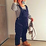 toddler, child, indoor, beanie, pacifier, striped_shirt, overalls, blanket, brown_boots, floor_tiles, door, wall, smiling, cute, standing, blue_eyes, clothing, person, baby, happy