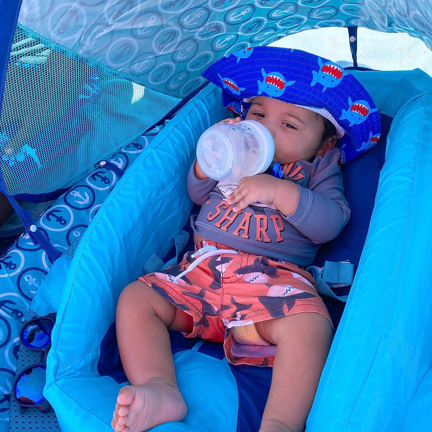 Aziel is registered to the contest to win money with this photo: aqua, azure, baby, baby_products, baby_toddler_clothing, beauty, blue, child, comfort, electric_blue, fun, hat, headwear, lap, leisure, mouth, person, purple, recreation, thigh