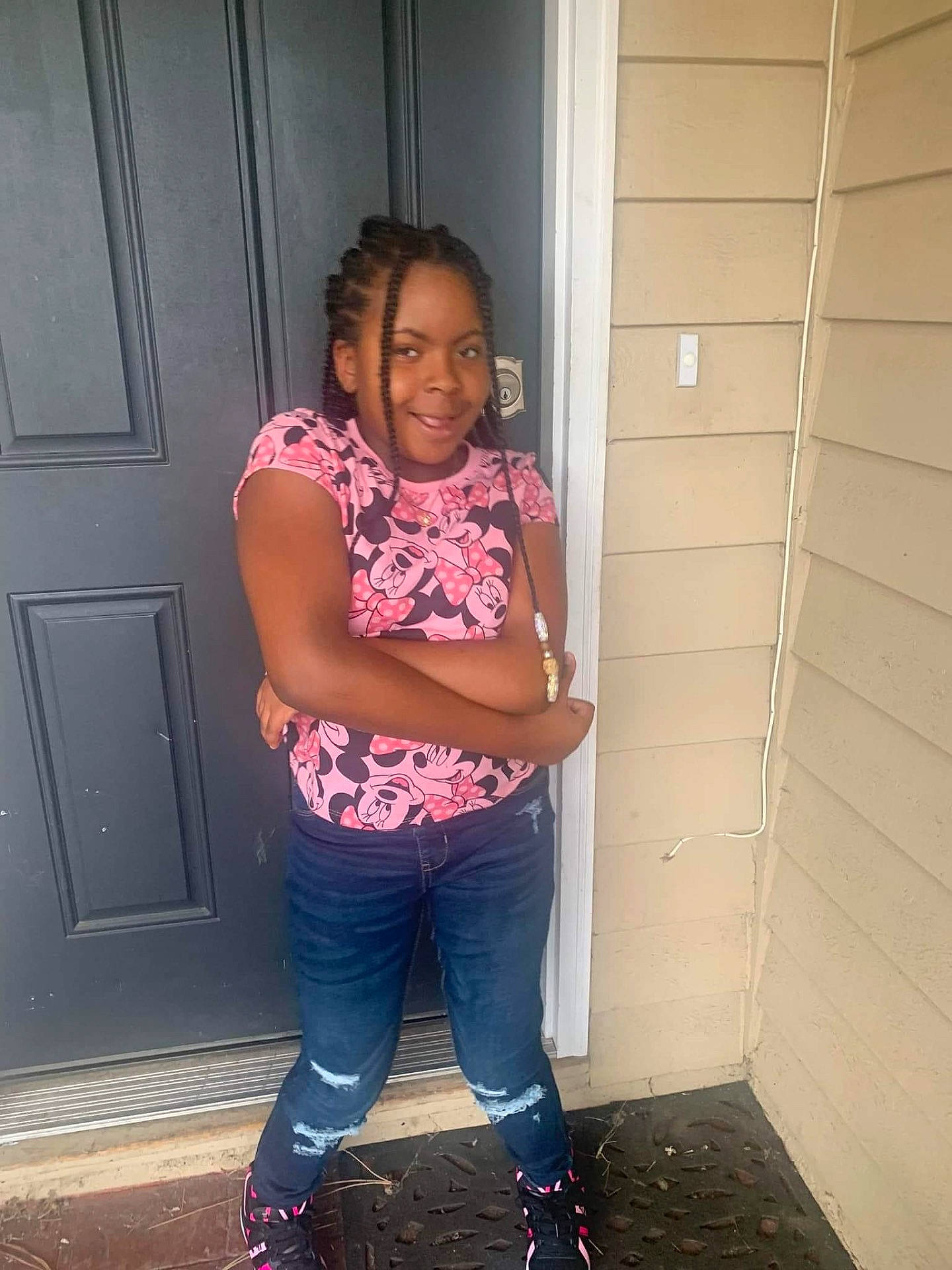 Jamiyah is registered to the contest to win money with this photo: braid, clothing, cornrows, curlyhair, face, female, girl, hair, head, jeans, pants, person, sleeve, standing, teen
