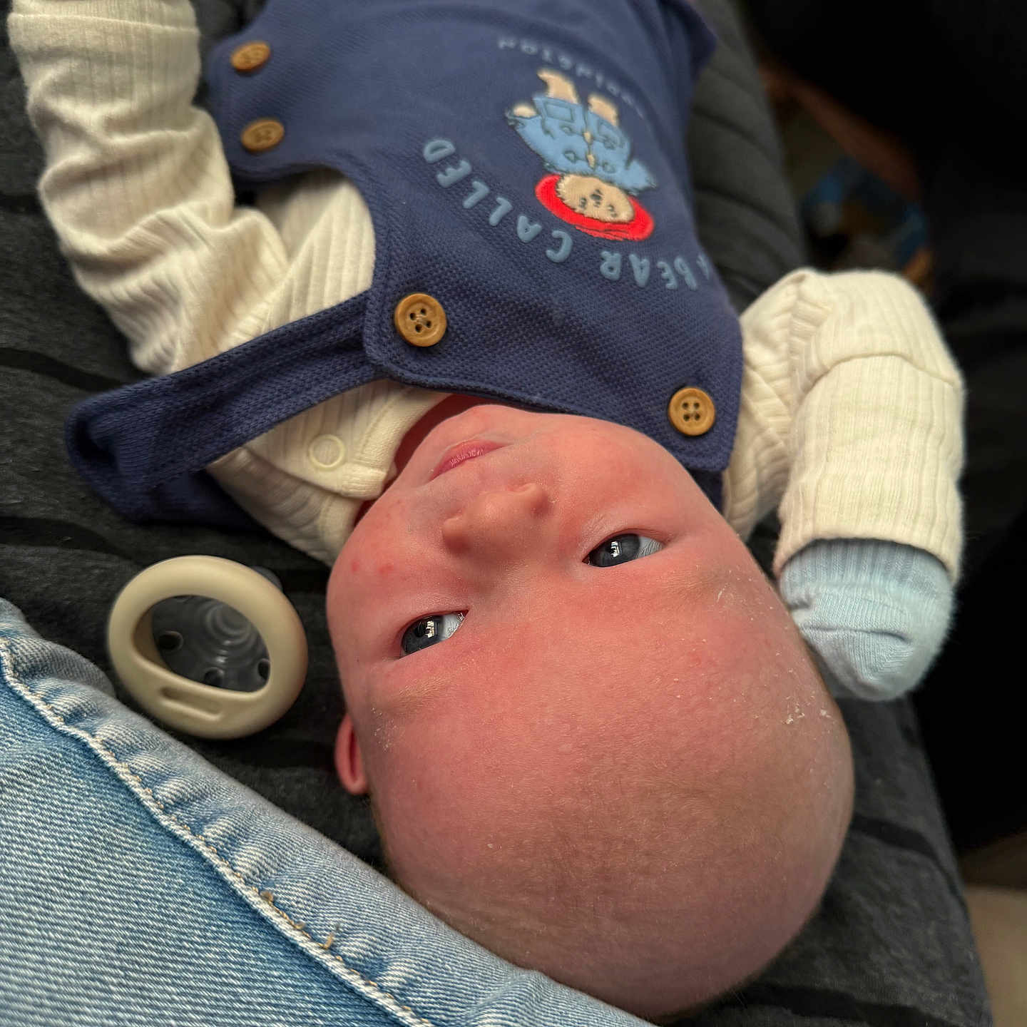 Elijah is registered to the contest to win money with this photo: baby, bodypart, cap, clothing, coat, couch, face, finger, hand, hat, head, jacket, jeans, knitwear, newborn, pants, person, photography, portrait, sweater