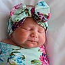 Octavia joined the competition — help win amazing prizes! baby, infant, sleeping, headband, bow, floral_pattern, swaddle, cute, peaceful, face, newborn, closeup, portrait, soft, skin, child, resting, adorable, pink, blue