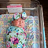 Octavia joined the competition — help win amazing prizes! newborn, baby, infant, sleeping, swaddle, headband, floral_pattern, hospital_bassinet, blanket, patchwork, label, wooden_floor, chair, indoor, peaceful, cute, girl, person, portrait, resting