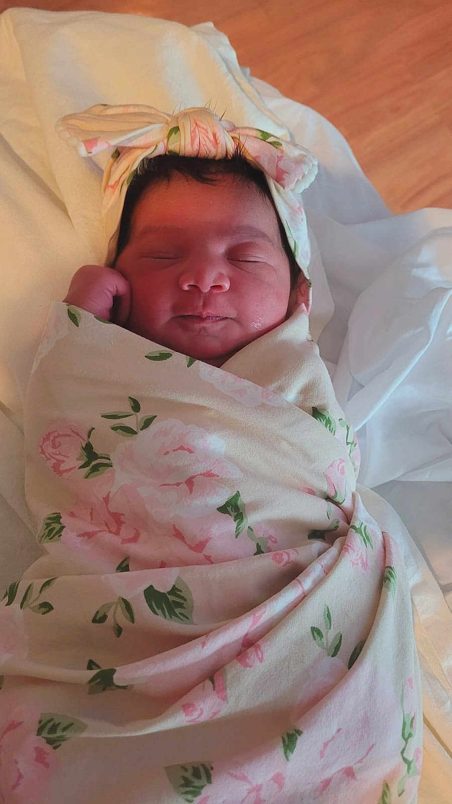 Emilianys Amirah is registered to the contest to win money with this photo: newborn, baby, sleeping, wrapped, blanket, floral_pattern, headband, infant, peaceful, soft, cute, portrait, indoors, resting, child, person, skin, face, cozy, warm