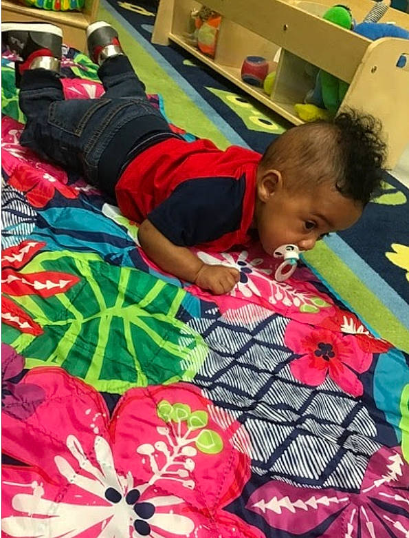 Micah joined the competition — help win amazing prizes! art, beauty, black, event, flooring, flower, fun, green, leisure, magenta, pattern, person, petal, photograph, plant, red, shorts, t_shirt, textile, toddler