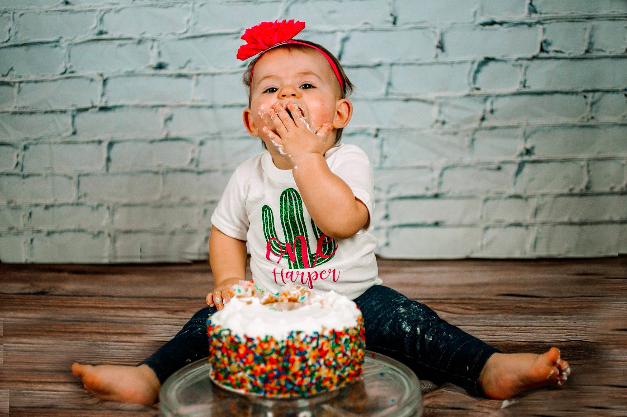 Harper is registered to the contest to win money with this photo: baby_toddler_clothing, birthday_cake, buttercream, cake, cake_decorating, cake_decorating_supply, child, dessert, event, face, flash_photography, food, fun, happy, person, photograph, shorts, sugar_cake, sweetness, toddler