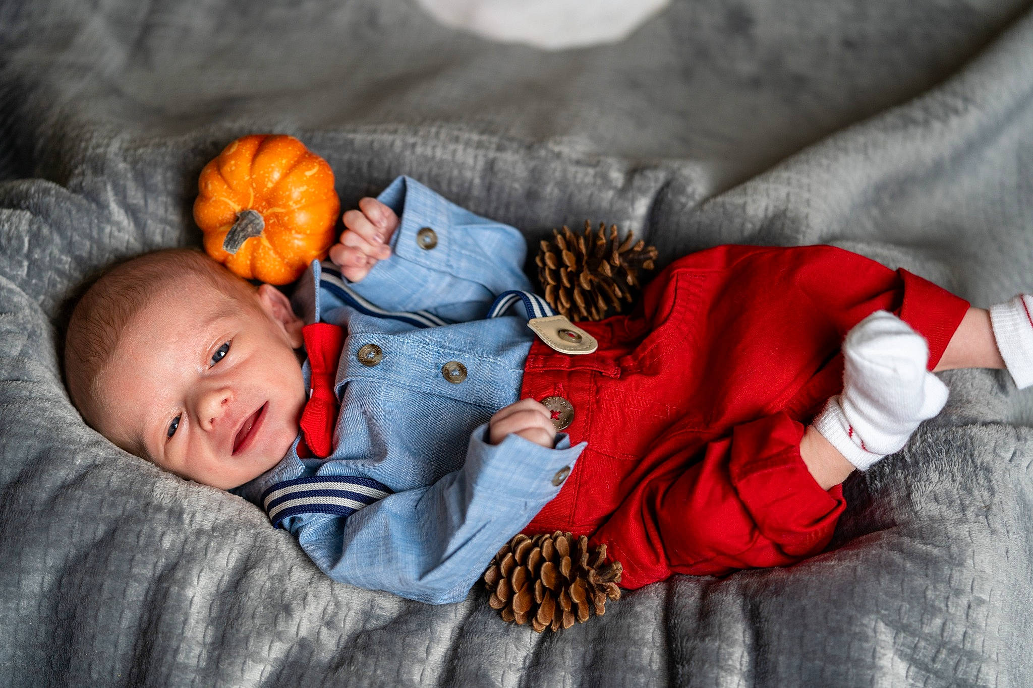 Aiden joined the competition — help win amazing prizes! baby, baby_sleeping, baby_toddler_clothing, calabaza, child, comfort, couch, eye, finger, gesture, hand, linens, orange, person, pumpkin, room, sitting, skin, sleeve, toddler