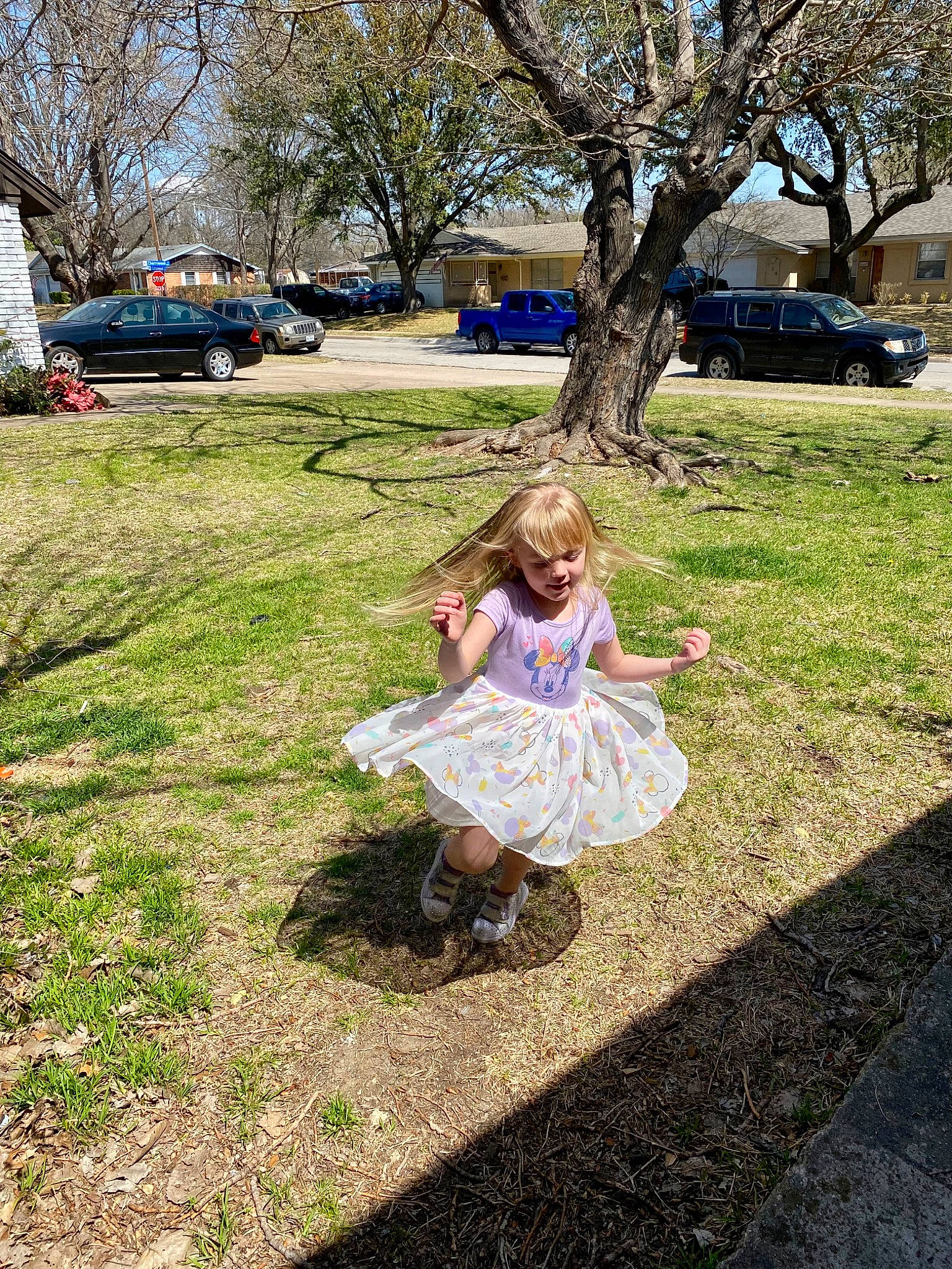 Angelina is registered to the contest to win money with this photo: botany, branch, car, daytime, fun, grass, leaf, leisure, mammal, morning, people_in_nature, person, plant, public_space, recreation, sneakers, summer, tire, tree, wheel