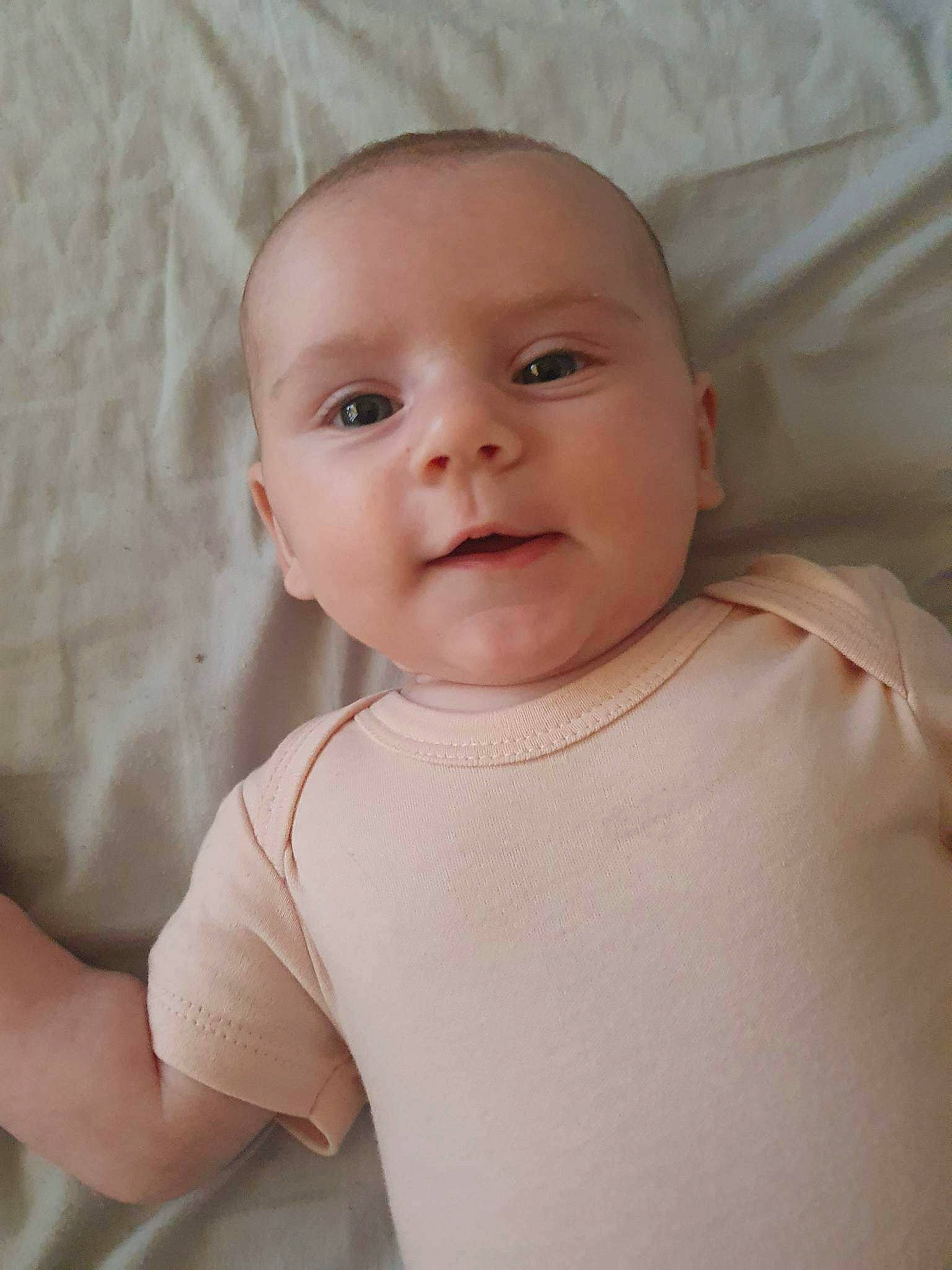 Frankie joined the competition — help win amazing prizes! baby, baby_toddler_clothing, cheek, child, chin, comfort, eyelash, facial_expression, happy, iris, lip, mouth, neck, nose, person, pink, skin, sleeve, smile, textile