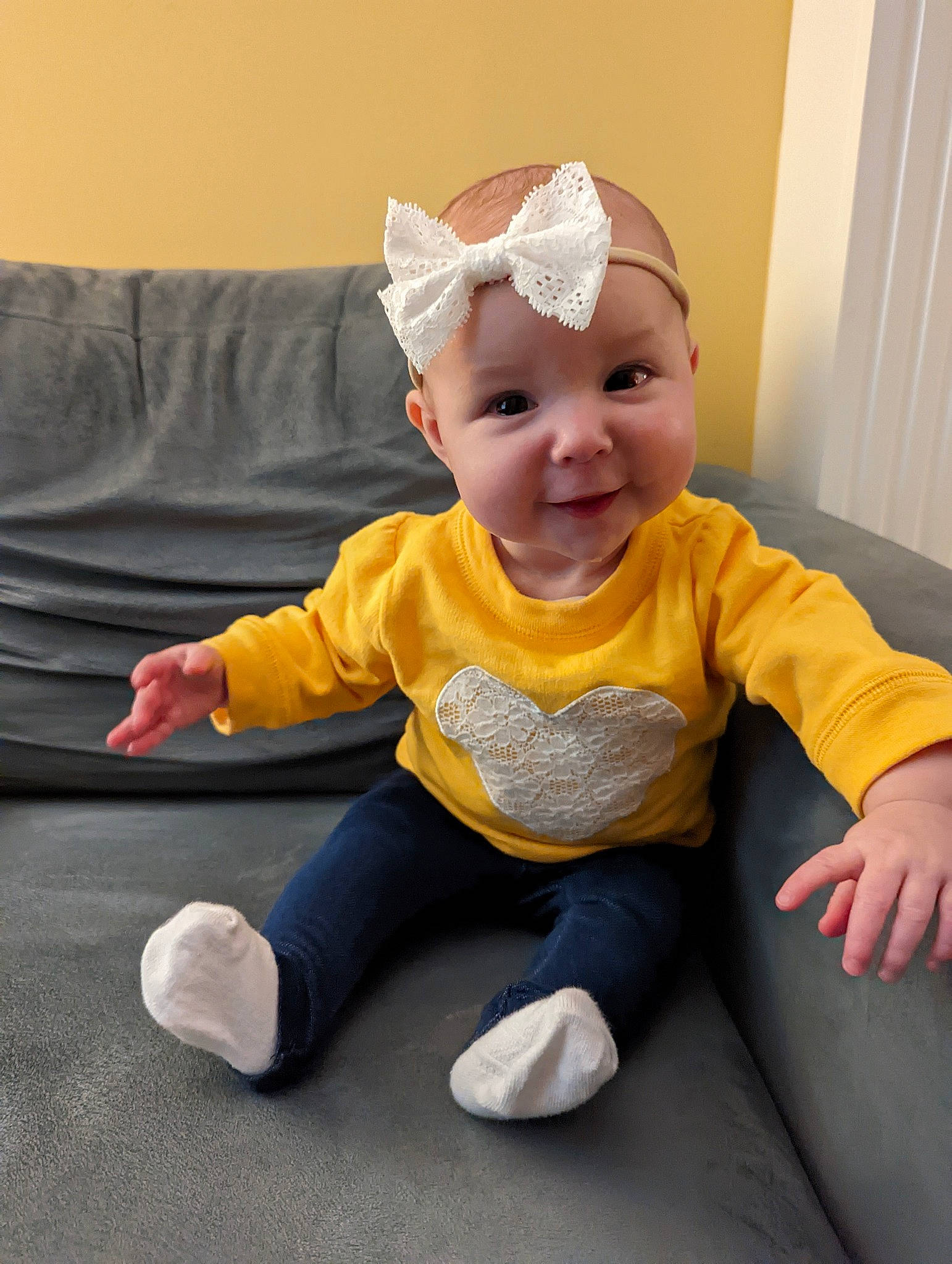 Hannah is registered to the contest to win money with this photo: baby, baby_toddler_clothing, child, clothing, comfort, costume_hat, face, facial_expression, fashion_accessory, flooring, fun, happy, hat, head, headband, headpiece, person, sitting, sleeve, smile