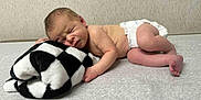 Miles is registered to the contest to win money with this photo: newborn, baby, sleeping, diaper, blanket, infant, skin, cute, peaceful, resting, lying_down, soft, cozy, child, toddler, indoor, portrait, newborn_baby, human, sleep