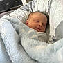 Miles joined the competition — help win amazing prizes! baby, newborn, sleeping, blanket, soft, cozy, smile, infant, wrapped, bedroom, home, interior, comfort, peaceful, cute, child, face, rest, warm, toddler