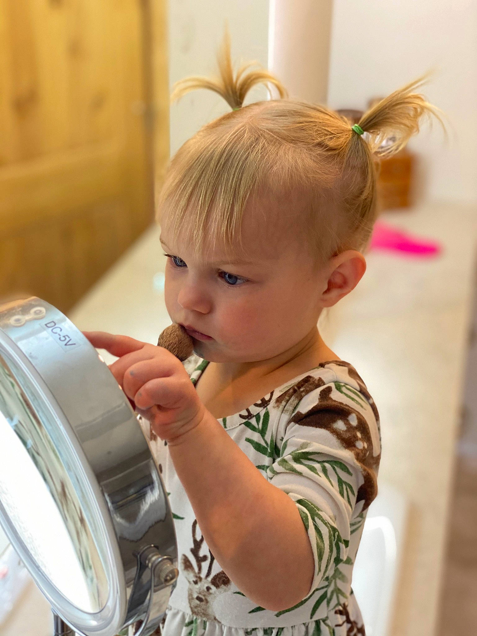 Daisy is registered to the contest to win money with this photo: automotive_wheel_system, blond, child, circle, drum, ear, happy, home_appliance, kitchen, laundry, laundry_room, major_appliance, membranophone, musical_instrument, person, rim, room, t_shirt, toddler, washing_machine