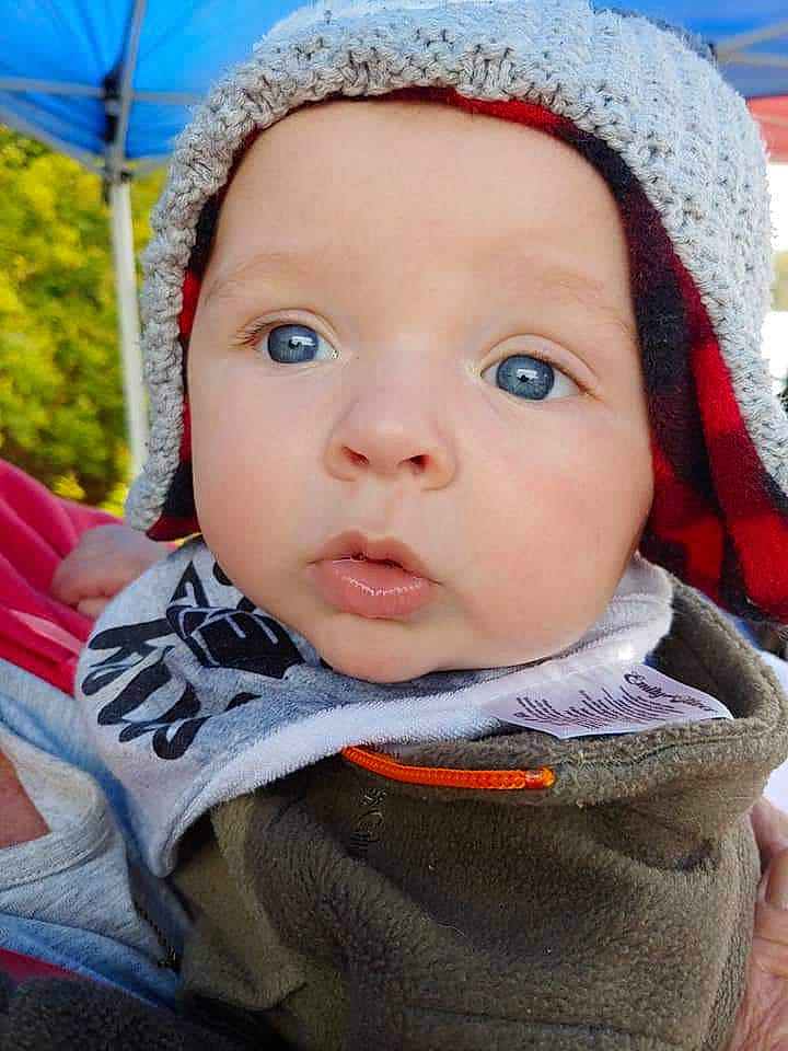 Kylar joined the competition — help win amazing prizes! baby, bonnet, cheek, child, chin, close_up, eye, face, head, headgear, knit_cap, lip, nose, person, skin, smile, toddler, wool