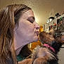 Princess Grace joined the competition — help win amazing prizes! woman, dog, kiss, affection, blur, motion, indoor, kitchen, refrigerator, photography, closeup, pet, companion, love, brown_hair, collar, small_dog, face, human, animal