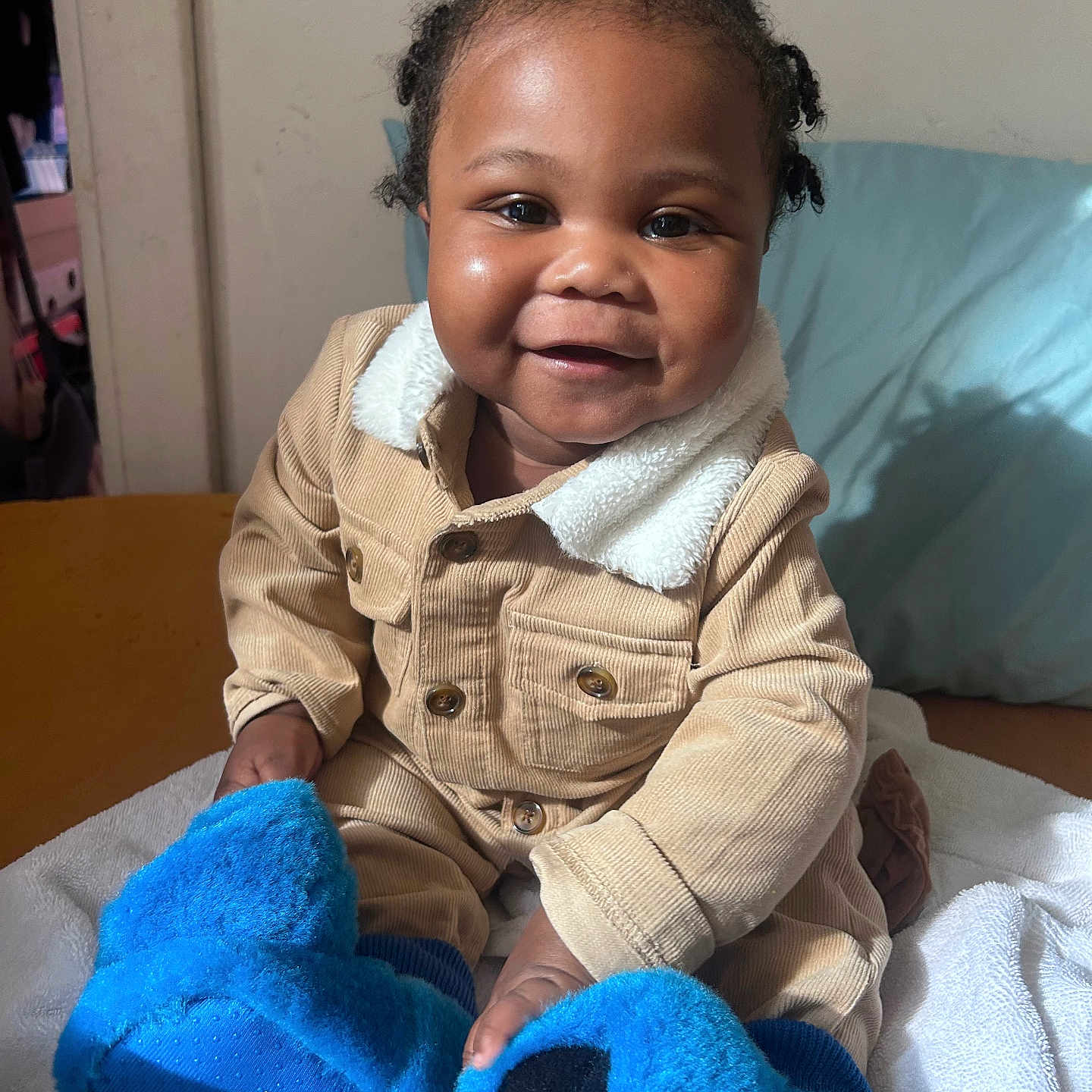 Michael joined the competition — help win amazing prizes! baby, babylaughing, bodypart, clothing, coat, couch, cushion, face, finger, furniture, glove, hand, happy, head, jacket, person, photography, portrait, sitting, smile