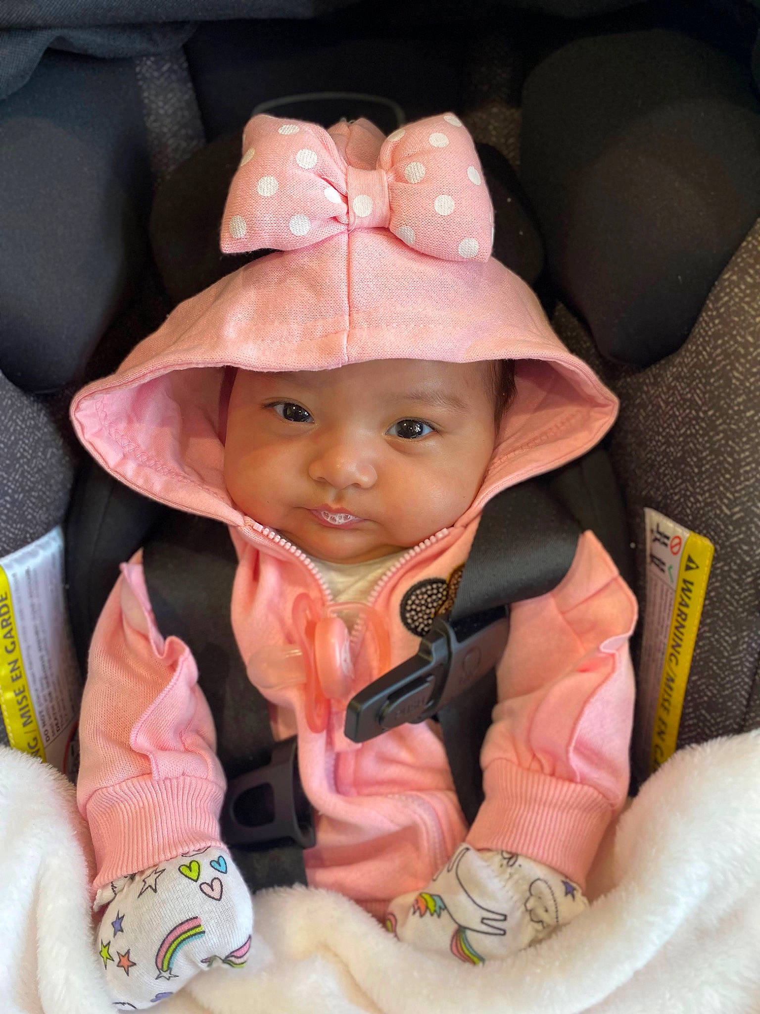 Jayline Ximena is registered to the contest to win money with this photo: baby, baby_toddler_clothing, cap, cheek, chin, eye, finger, gesture, hat, head, headgear, headwear, iris, lip, mouth, nose, person, pink, skin, textile