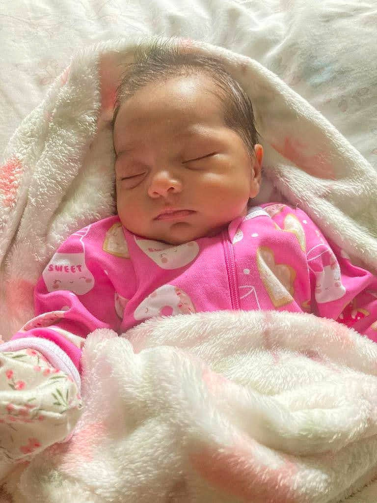 Jayline Ximena joined the competition — help win amazing prizes! baby, baby_products, baby_sleeping, baby_toddler_clothing, bedding, bedtime, cheek, child, chin, comfort, face, fur, linens, magenta, nose, person, pink, room, skin, textile