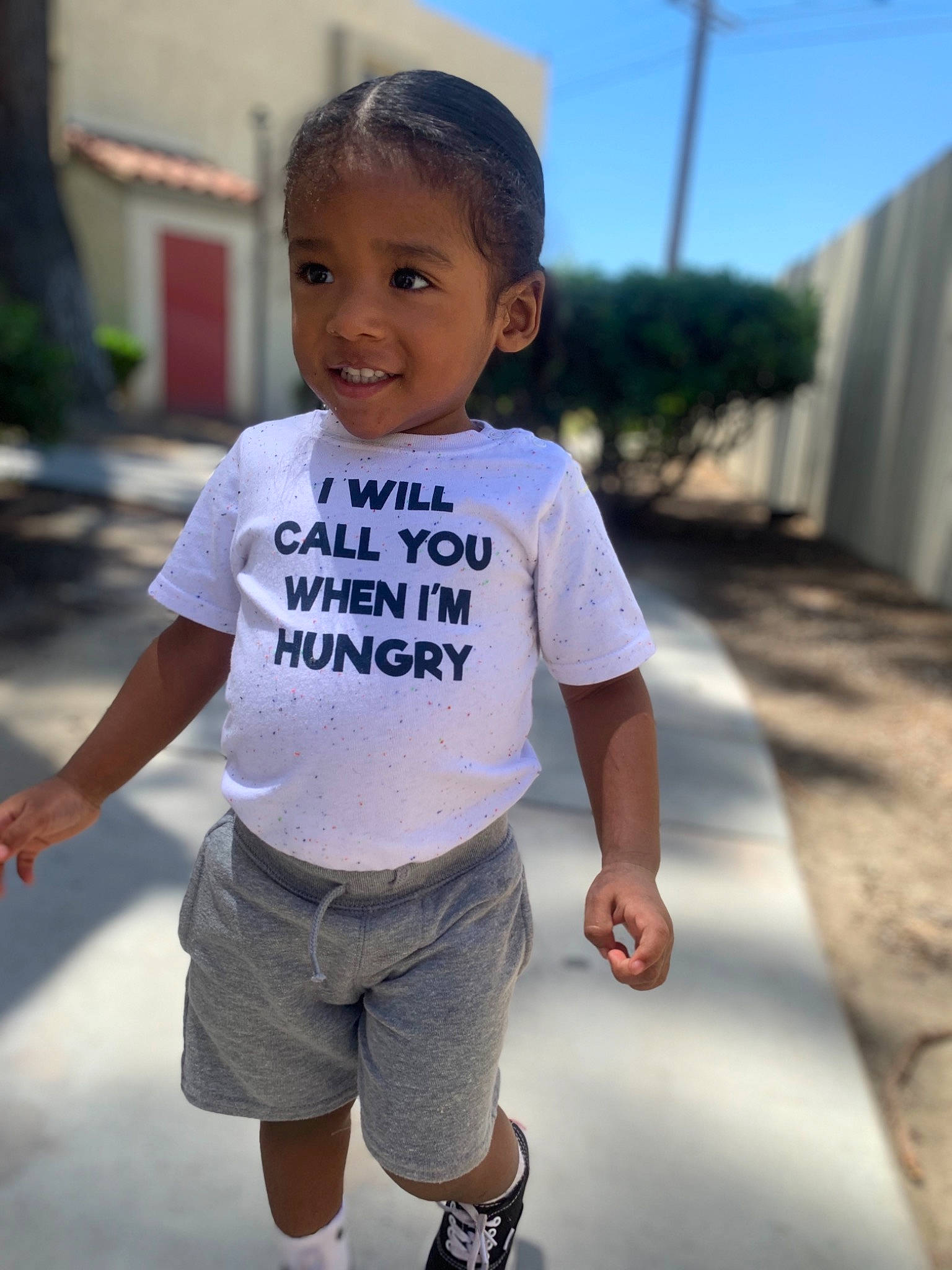 Kalvin is registered to the contest to win money with this photo: baby, child, cool, face, happy, head, jeans, joy, lip, person, photography, shoe, shoulder, skin, sleeve, smile, t_shirt, toddler, top, vacation