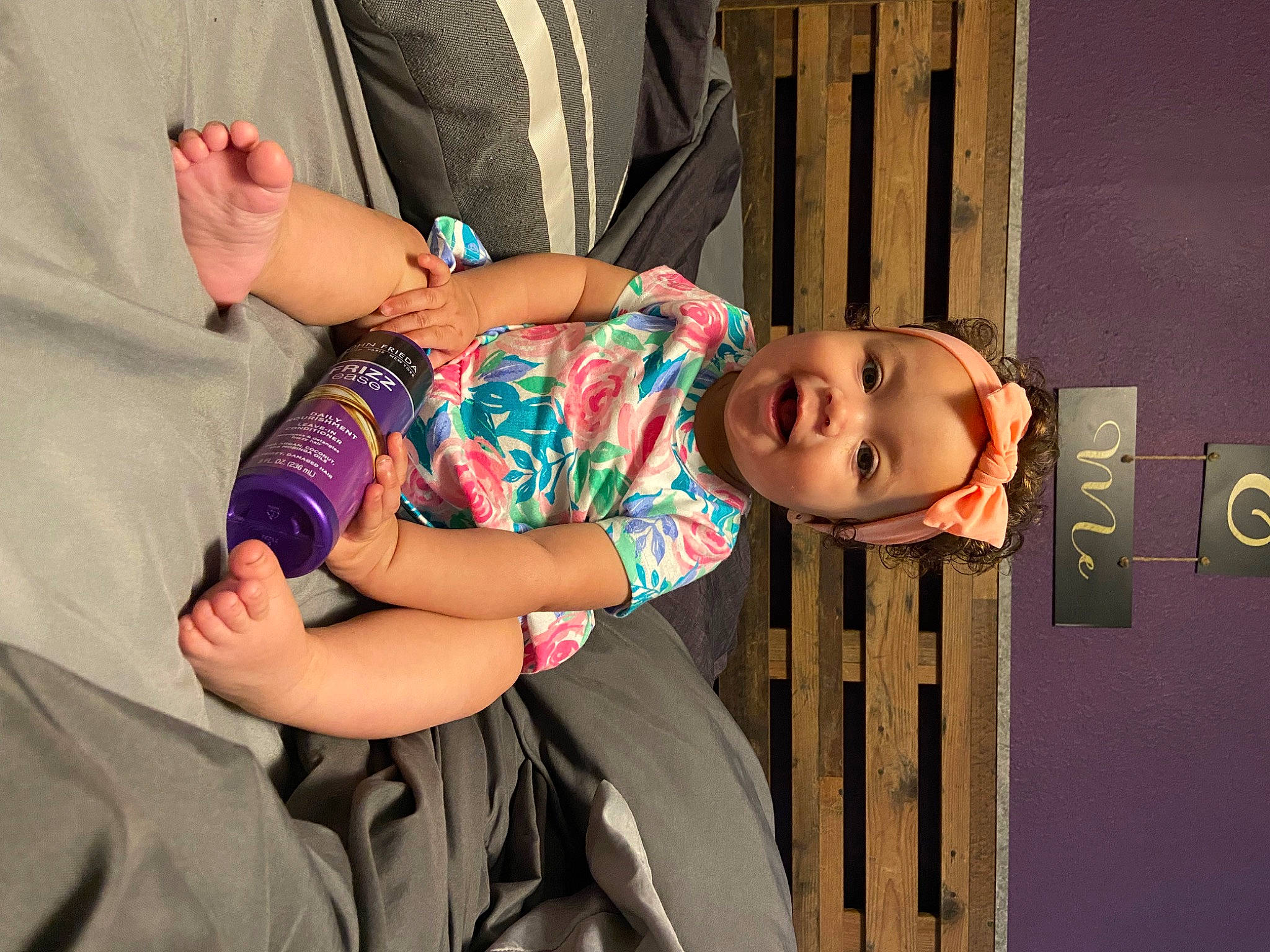 Kira is registered to the contest to win money with this photo: abdomen, baby_toddler_clothing, comfort, dress, elbow, eye, facial_expression, finger, fun, gesture, happy, human_leg, joint, leg, person, pink, shoulder, thigh, toddler, trunk