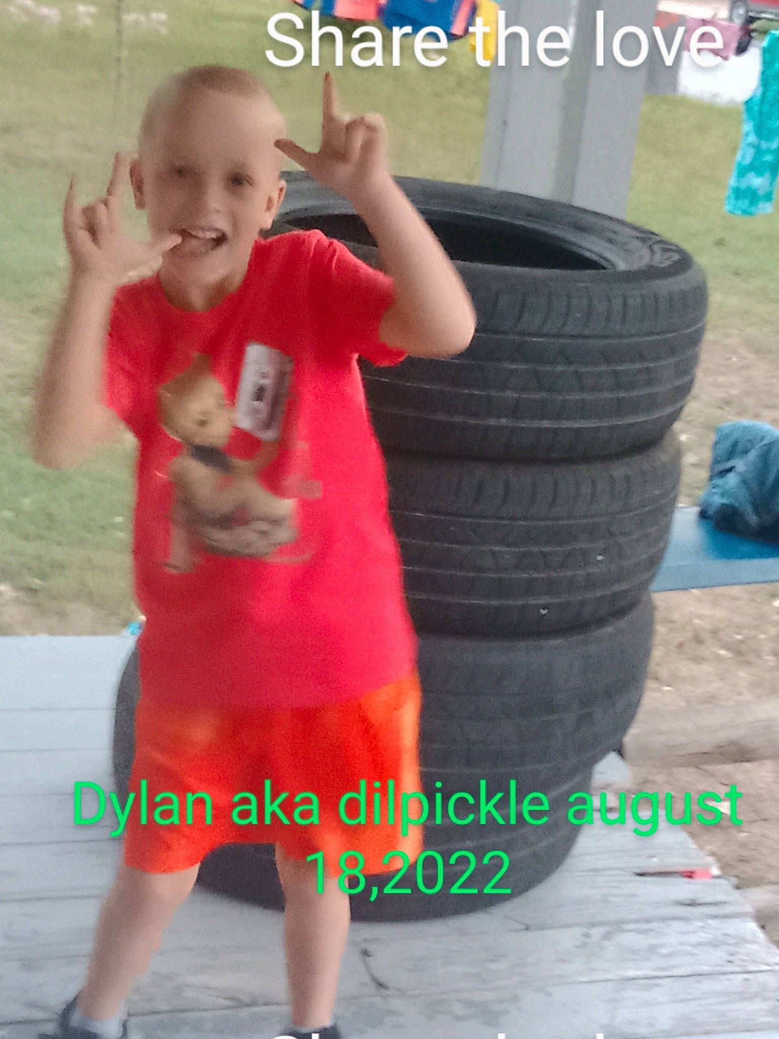 Dylan is registered to the contest to win money with this photo: automotive_tire, automotive_wheel_system, baby_toddler_clothing, child, fun, hairstyle, happy, joy, person, rim, shorts, sitting, sleeve, smile, synthetic_rubber, t_shirt, thigh, tire, tire_care, toddler