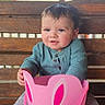 toddler, child, baby, bench, wooden_bench, bucket, pink_bucket, bunny_face, cute, smiling, sitting, clothing, long_sleeve, pants, barefoot, outdoor, daylight, portrait, person, playful