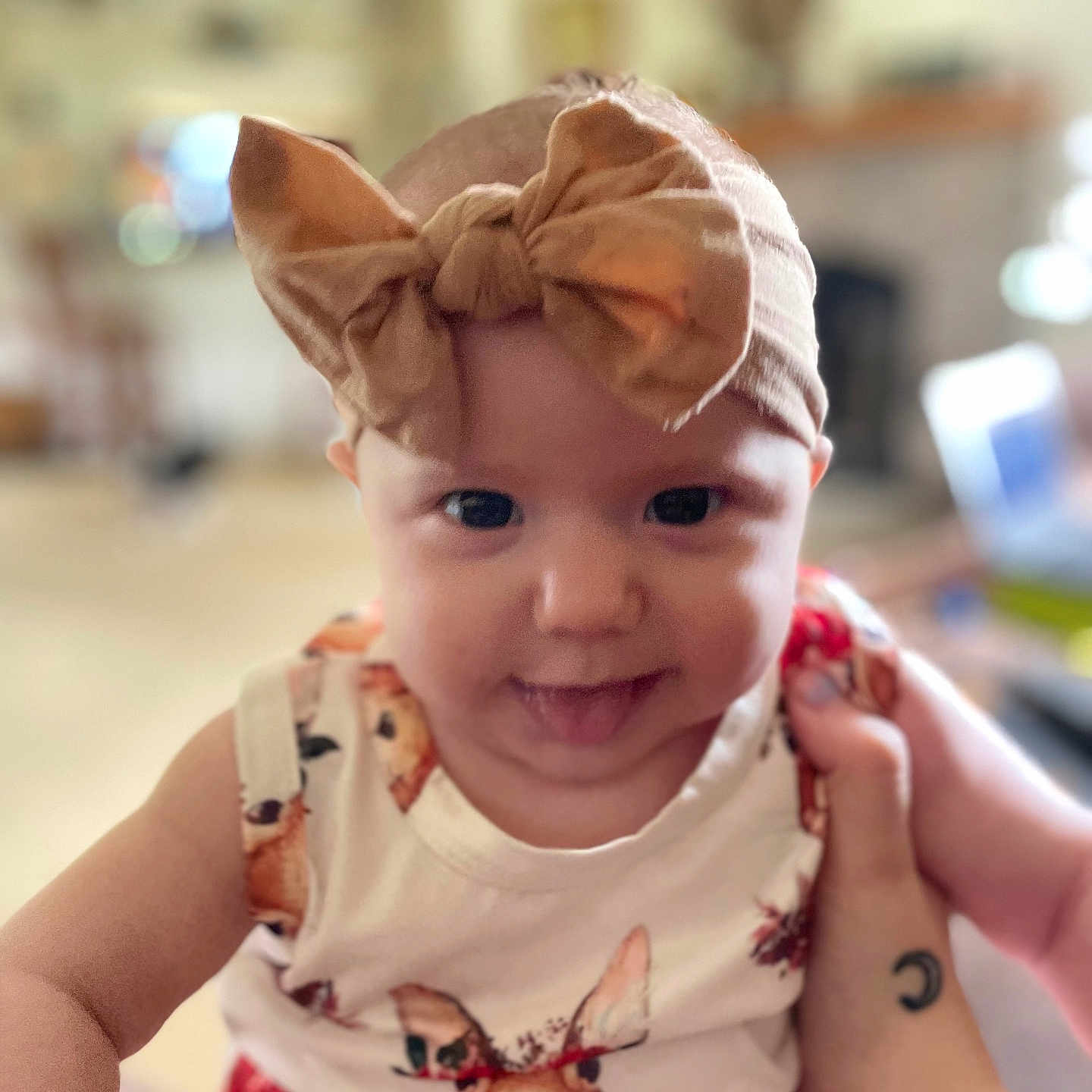 Delilah is registered to the contest to win money with this photo: accessories, baby, bodypart, cap, clothing, costume, dress, face, finger, hand, happy, hat, head, jewelry, necklace, person, photography, portrait, smile, t_shirt