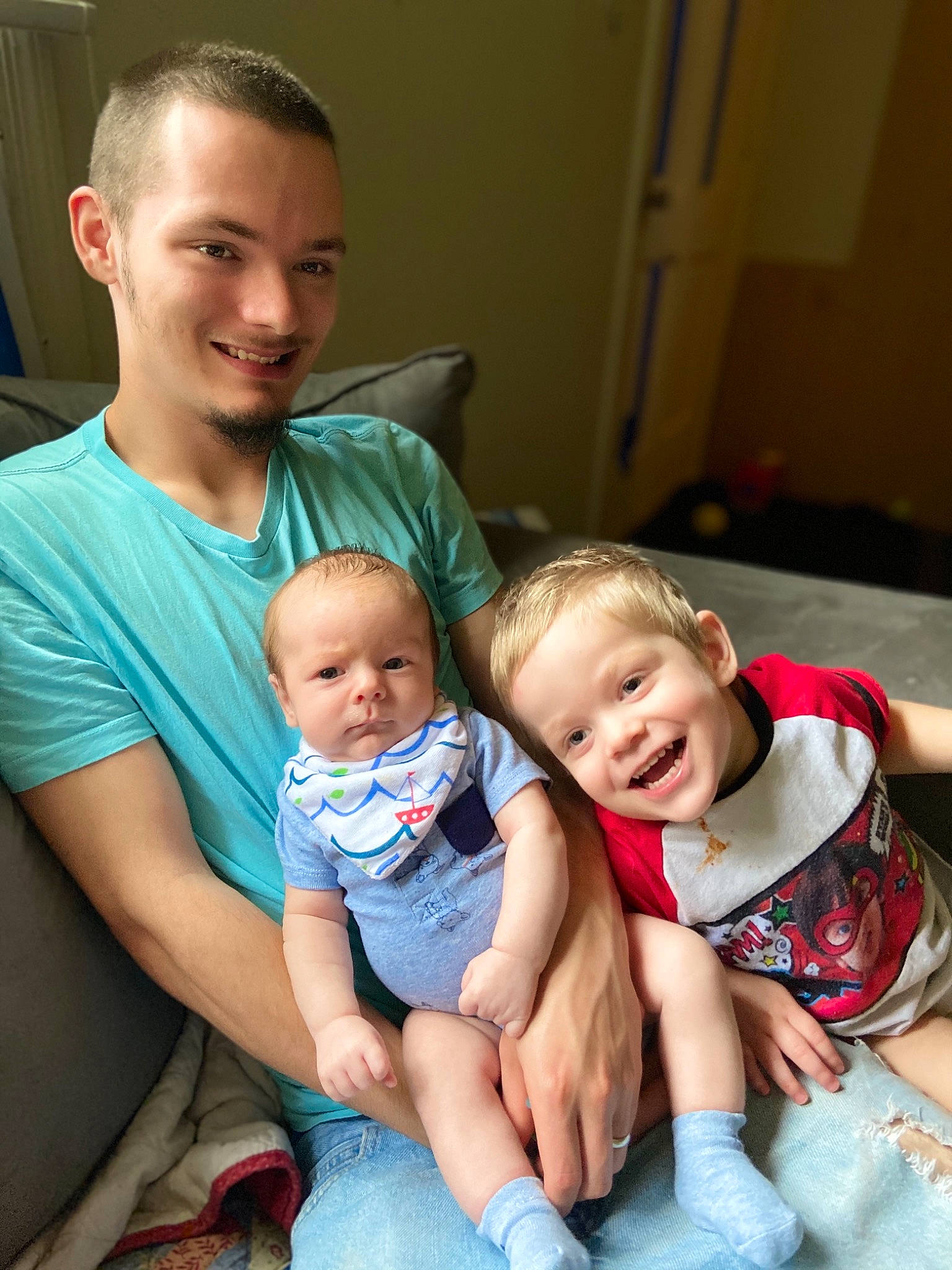 Ethan is registered to the contest to win money with this photo: baby, child, family, fun, happy, joy, leg, people, person, sibling, sitting, smile, toddler, vacation