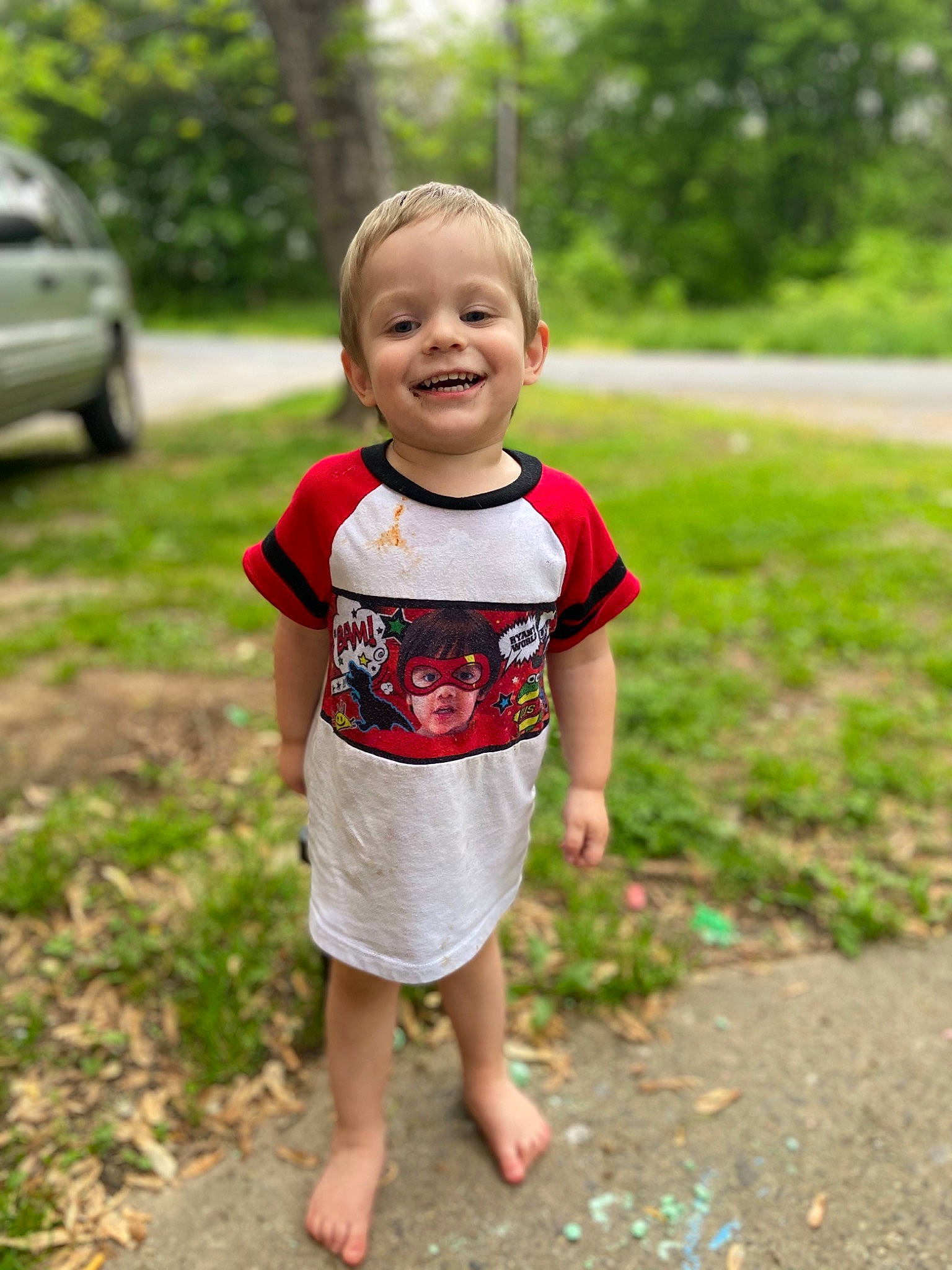 Ethan joined the competition — help win amazing prizes! child, face, facial_expression, fun, grass, green, head, joy, leaf, people, person, photography, plant, play, red, smile, standing, summer, toddler, tree