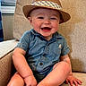 Jaxon joined the competition — help win amazing prizes! baby, child, smiling, hat, fedora, blue_shirt, armchair, beige, indoor, window, curtains, happy, cute, infant, portrait, sitting, toes, furniture, home, casual_clothing