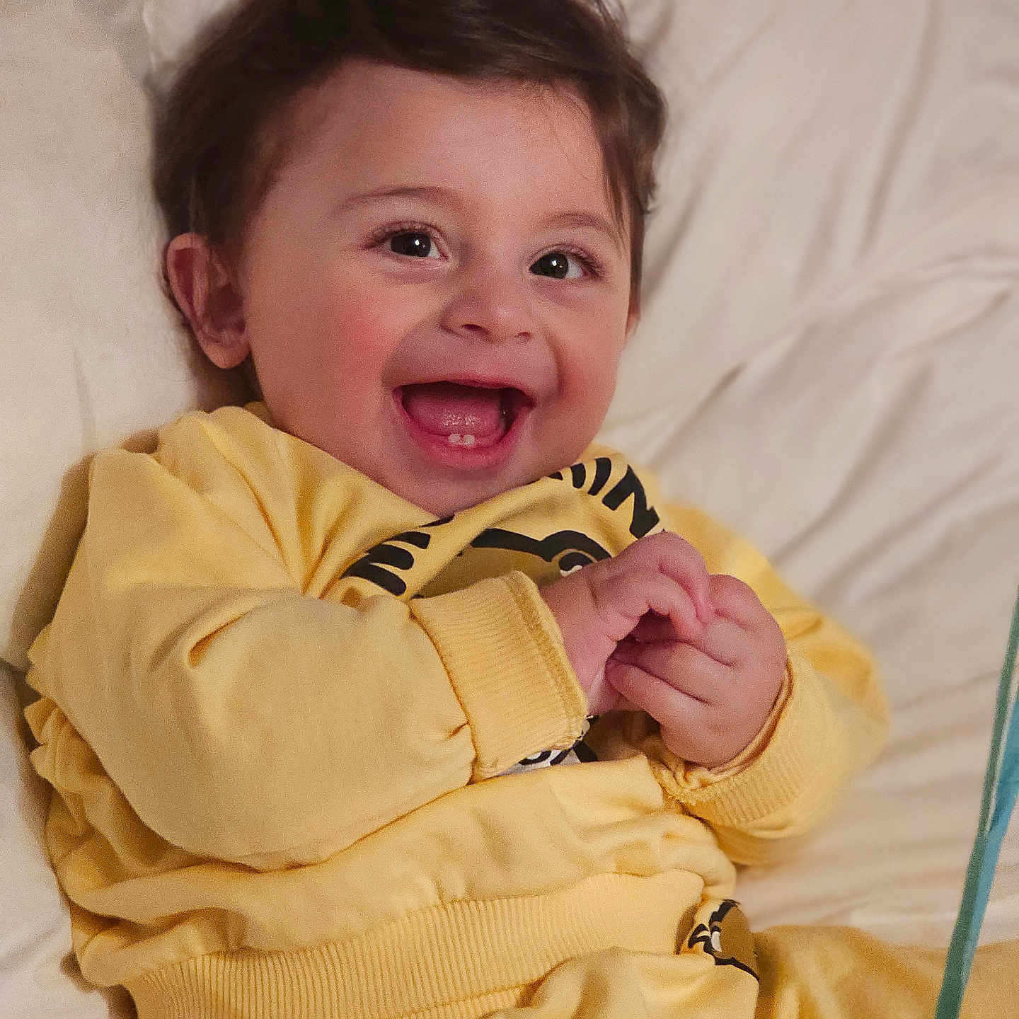 Brando is registered to the contest to win money with this photo: baby, babylaughing, bed, blanket, bodypart, clothing, coat, couch, face, finger, furniture, hand, happy, head, laughing, newborn, person, photography, portrait, smile