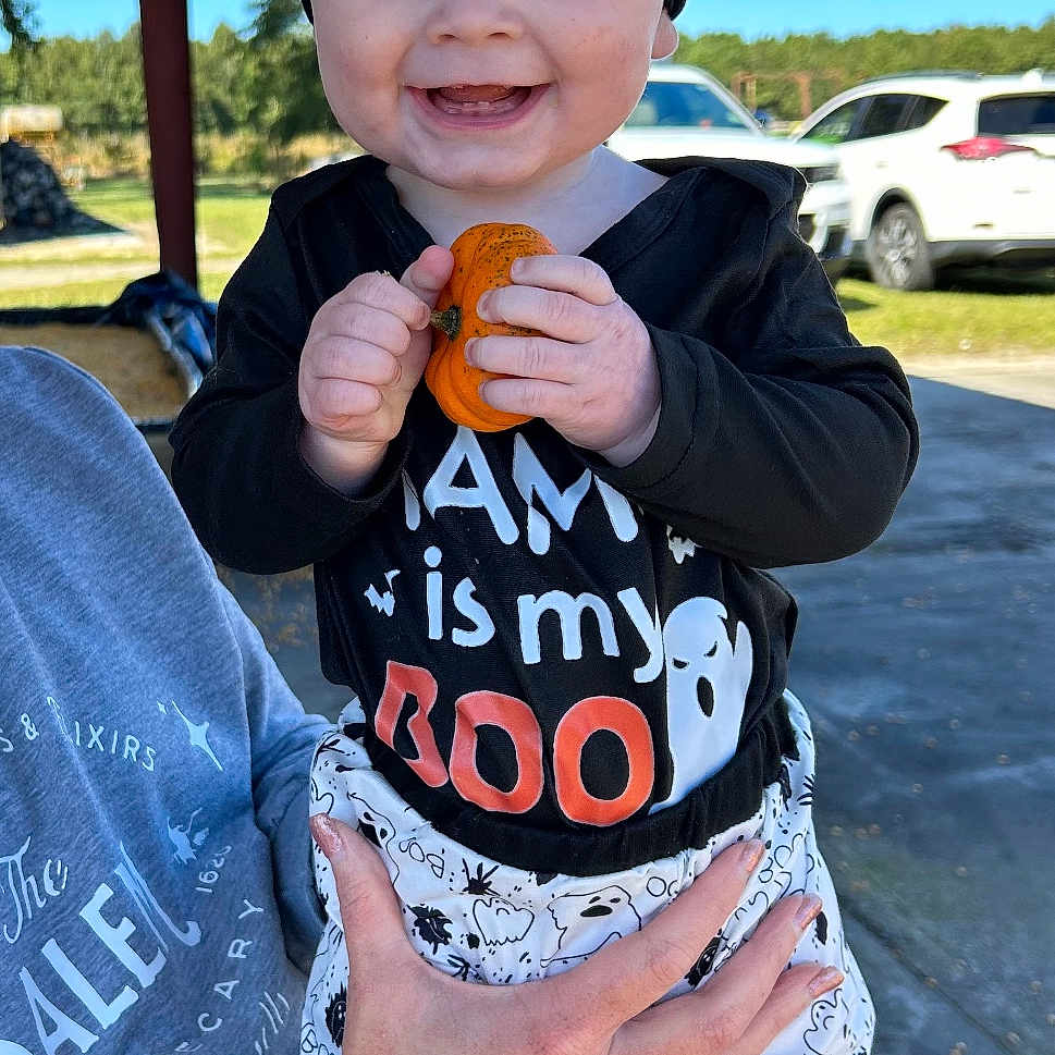 Kayce joined the competition — help win amazing prizes! architecture, baby, baseballcap, bodypart, building, cap, clothing, coat, face, finger, hand, hat, head, jacket, jeans, pants, person, photography, portrait, t_shirt