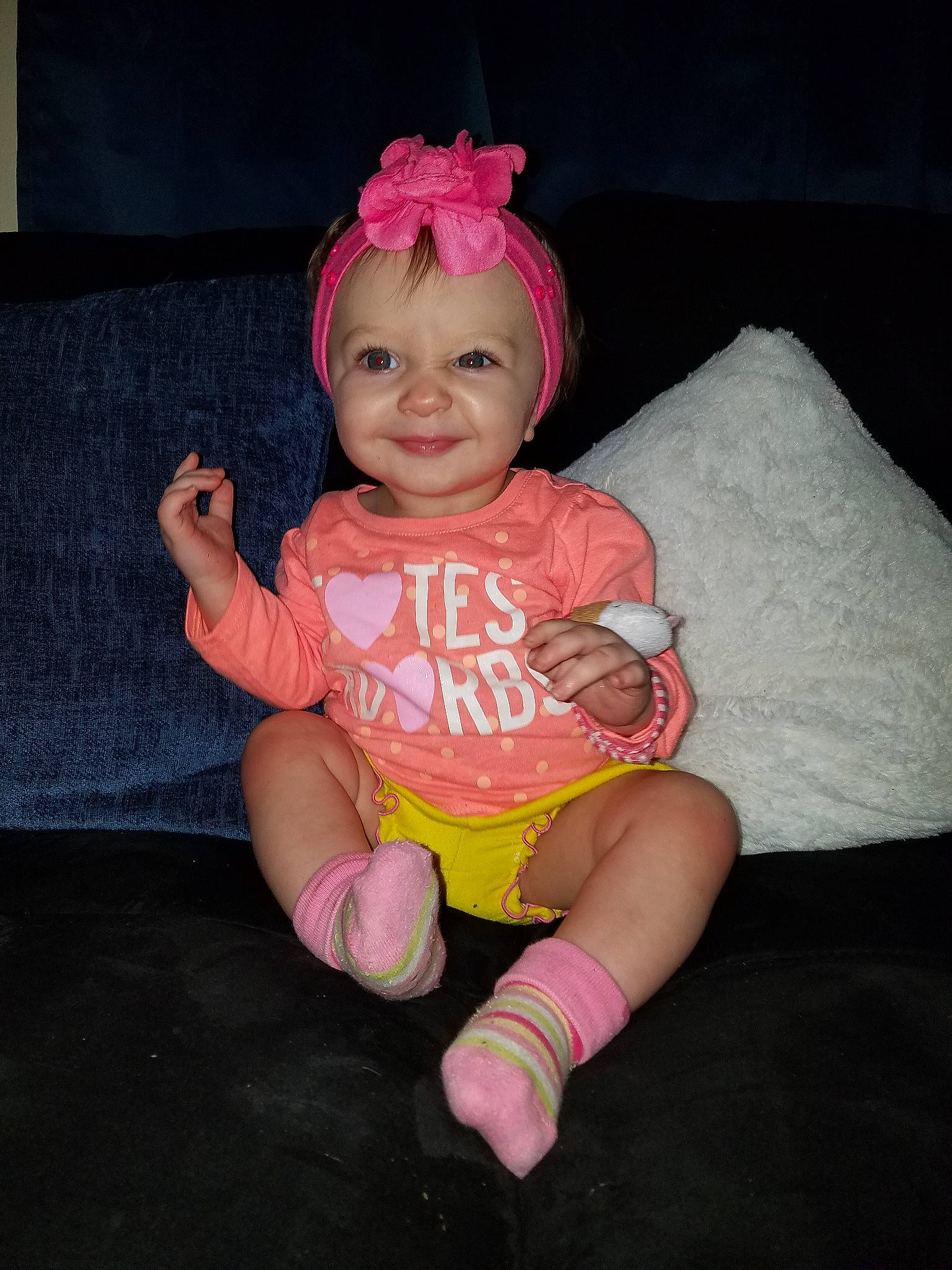 Nyla Rose is registered to the contest to win money with this photo: child, costume, fun, girl, hand, headgear, human_body, human_hair_color, infant, joy, leg, organ, person, pink, product, sitting, skin, smile, toddler