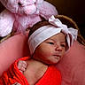 newborn, baby, infant, pink_bear, plush_toy, headband, blanket, red_cloth, cushion, basket, soft_toy, portrait, cute, indoors, child, sleepy, wrapped, baby_clothes, teddy_bear, baby_boy