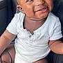 baby, child, infant, smiling, white_onesie, car_seat, seat, portrait, happy, cute, skin, face, eyes, hand, foot, sitting, clothing, indoors, childhood, person