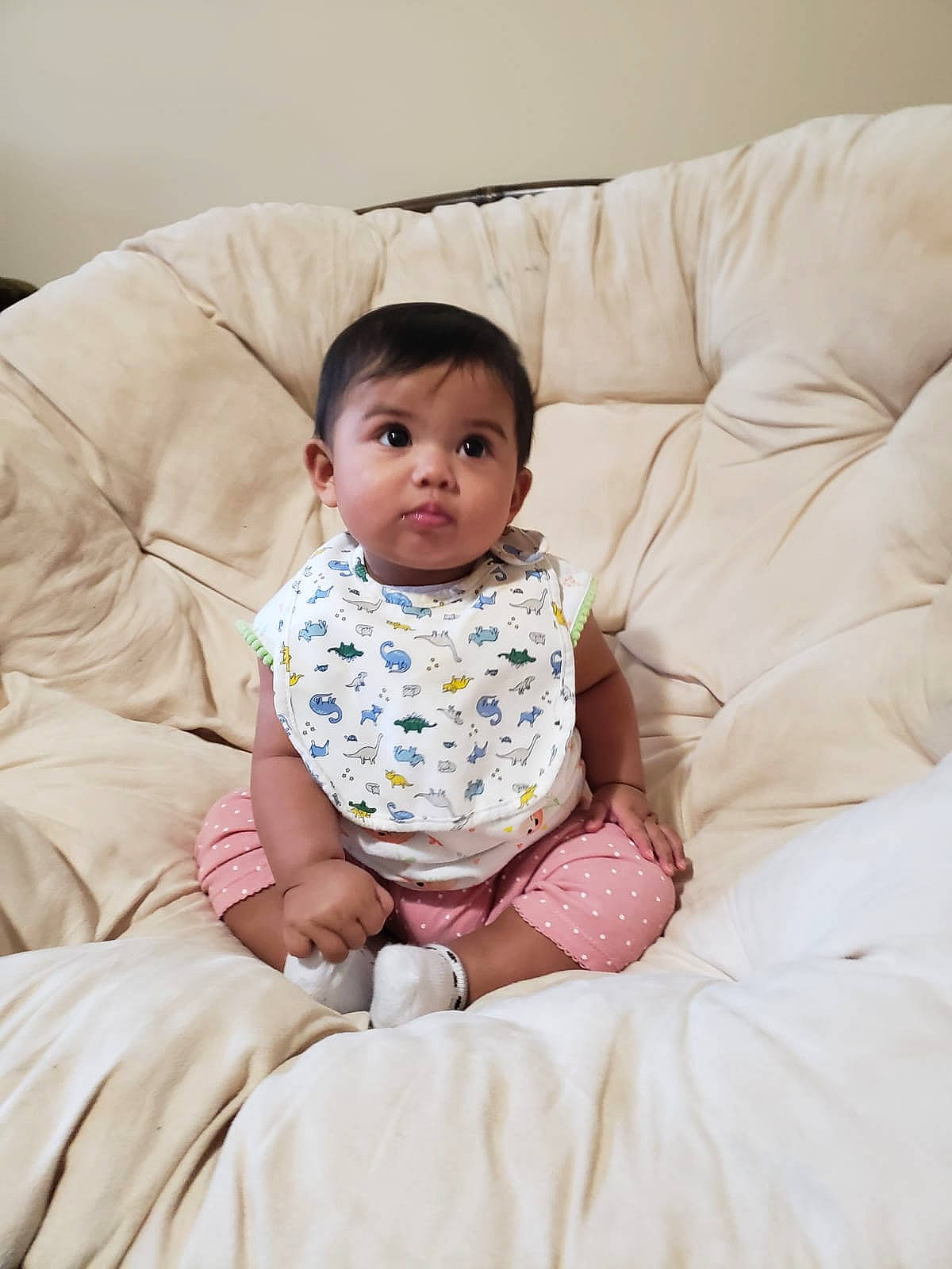 Aisha is registered to the contest to win money with this photo: baby, beauty, cheek, child, comfort, daughter, furniture, person, pink, sitting, skin, smile, toddler