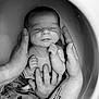 baby, newborn, infant, hands, water, bath, black_and_white, tattoo, peaceful, sleeping, skin, adult_hands, close_up, portrait, parent, family, resting, soft, baby_clothes, caring
