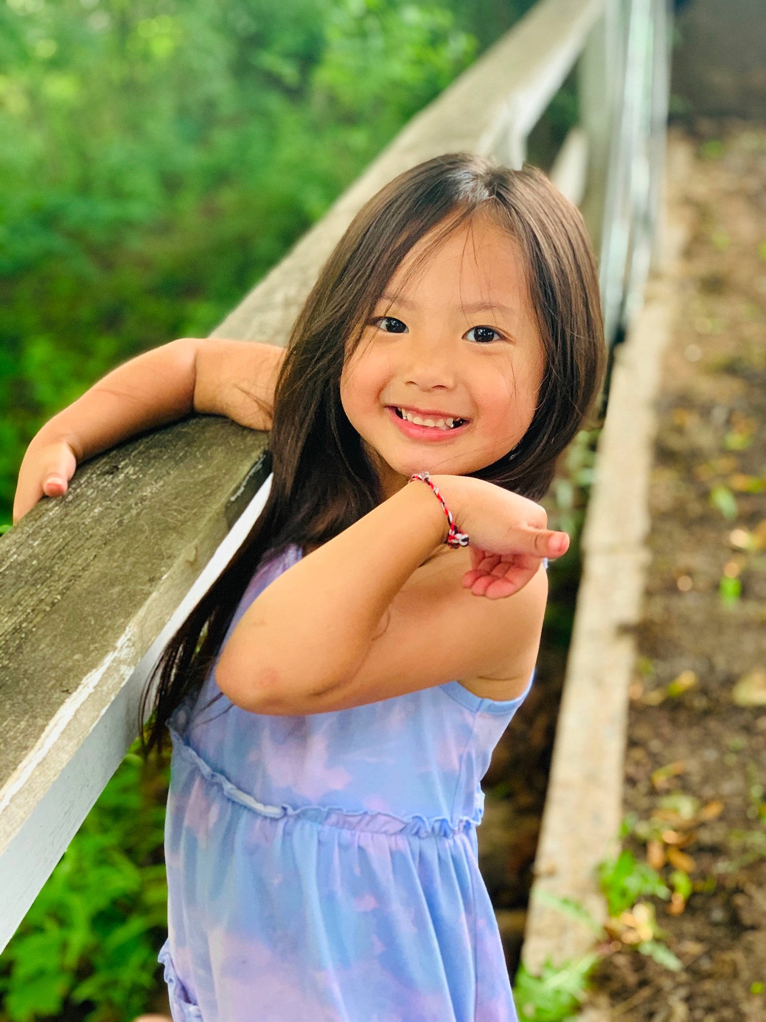 Vienna is registered to the contest to win money with this photo: child, dress, eye, facial_expression, flash_photography, fun, grass, hairstyle, happy, joy, leisure, lip, long_hair, people_in_nature, person, plant, skin, smile, summer, sunlight