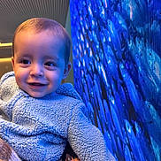 Winston joined the competition — help win amazing prizes! toddler, child, blue_jacket, smile, face, hand, fleece, indoor, digital_screen, pixels, person, portrait, holding, happy, cute, baby, clothing, warm, texture, colorful