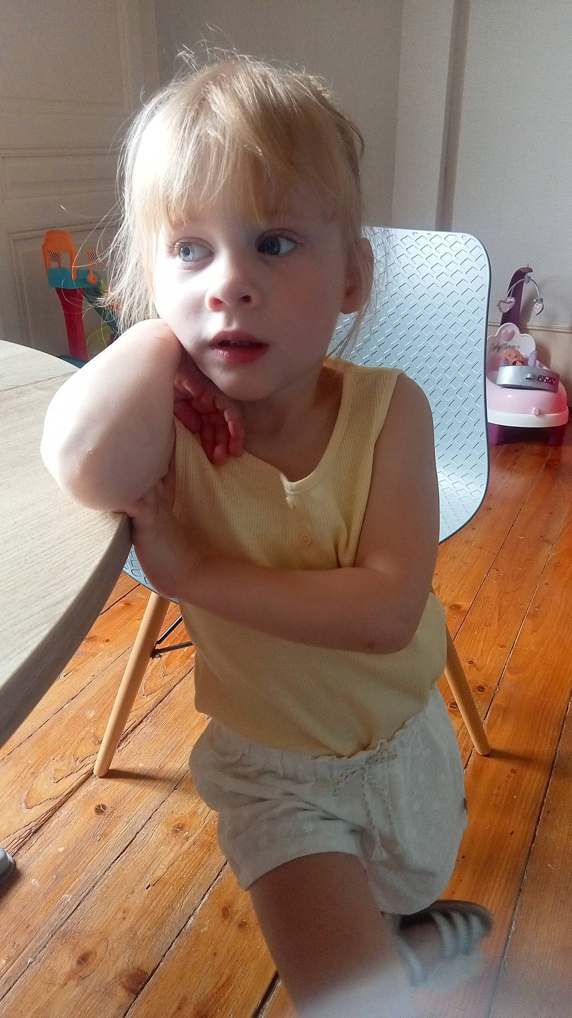 Taïna a rejoint le concours — aidez-le/la à gagner de superbes lots ! active_tank, baby_toddler_clothing, cheek, chest, chin, eye, face, flooring, hair, head, mouth, neck, nose, person, shorts, shoulder, skin, thigh, toddler, trunk