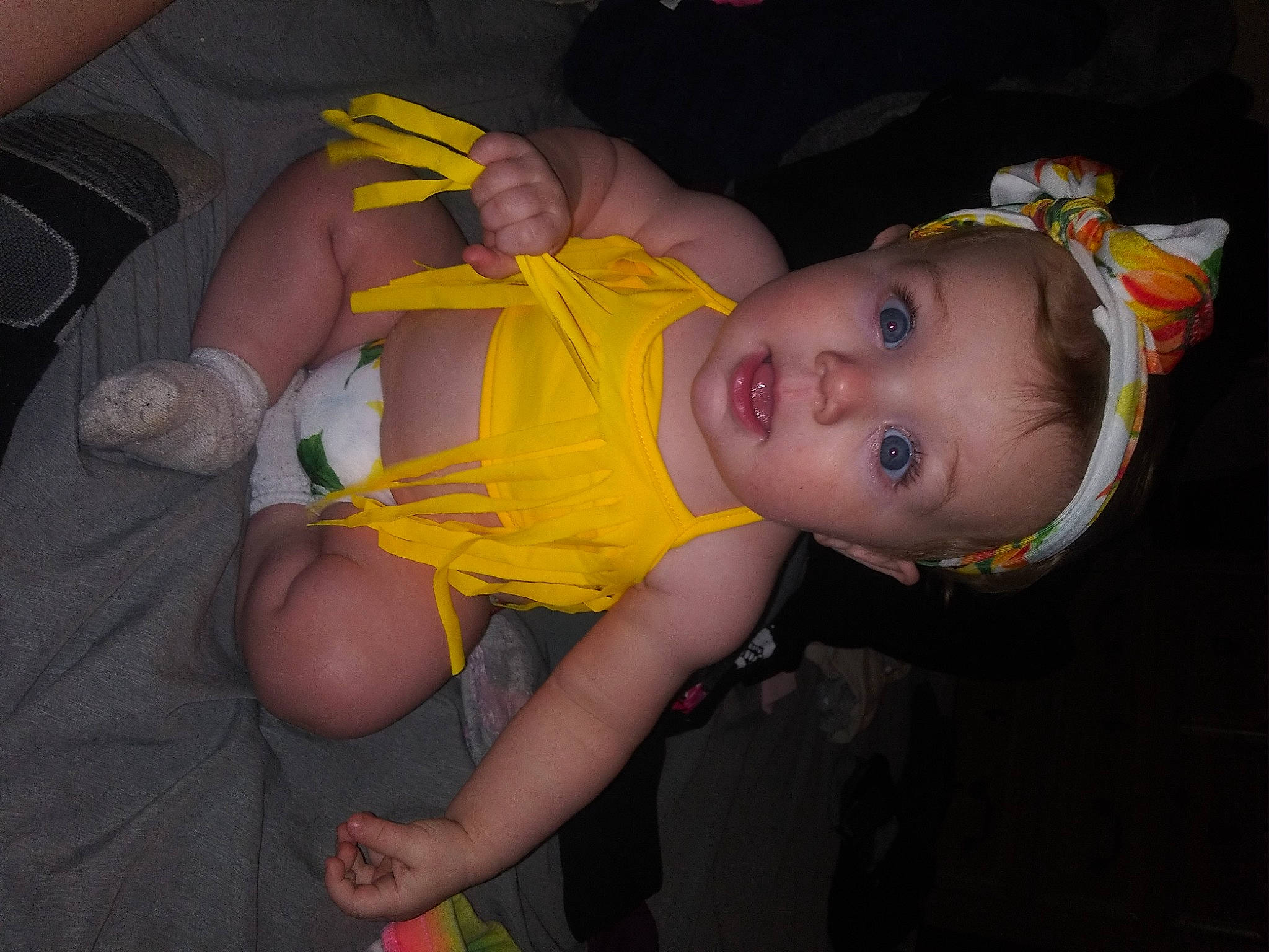 Rayna is registered to the contest to win money with this photo: baby, baby_products, baby_toddler_clothing, cheek, child, fun, gesture, hand, happy, human_body, human_leg, iris, knee, mouth, nail, nose, person, surprise, thigh, thumb