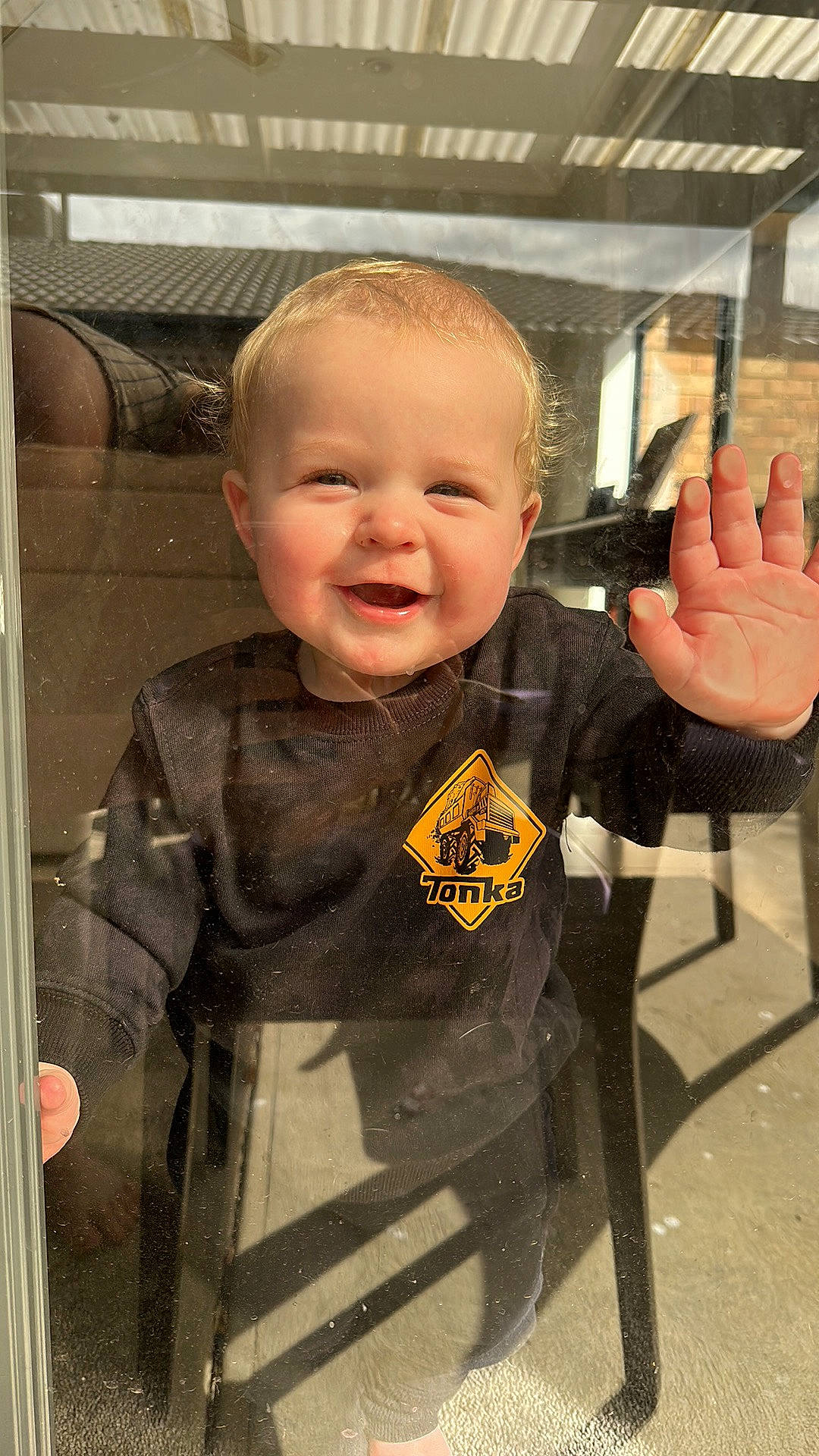 Jordan is registered to the contest to win money with this photo: baby, baby_toddler_clothing, cheek, child, face, finger, fun, gesture, happy, joy, pattern, person, product, sitting, skin, sleeve, smile, standing, t_shirt, thumb