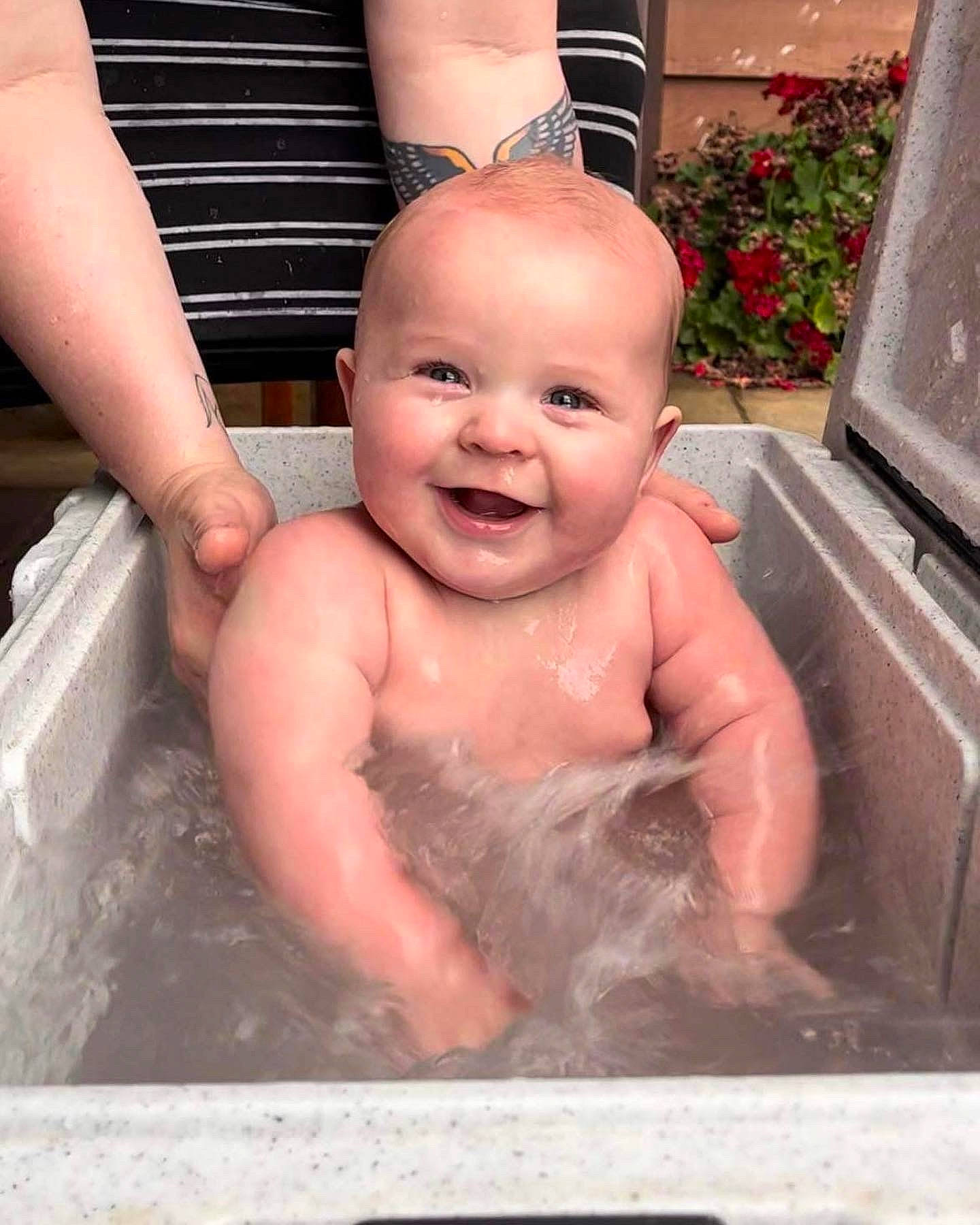 Jordan is registered to the contest to win money with this photo: baby, baby_bathing, bathing, bathroom, cheek, chest, finger, fluid, fun, hand, happy, leisure, person, pink, plant, plumbing_fixture, skin, smile, thumb, toddler