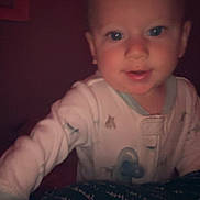 Asher is registered to the contest to win money with this photo: baby, child, pajamas, indoor, portrait, face, person, infant, young_child, cute, expression, looking, lighting, hand, night, closeup, human, skin, head, eyes