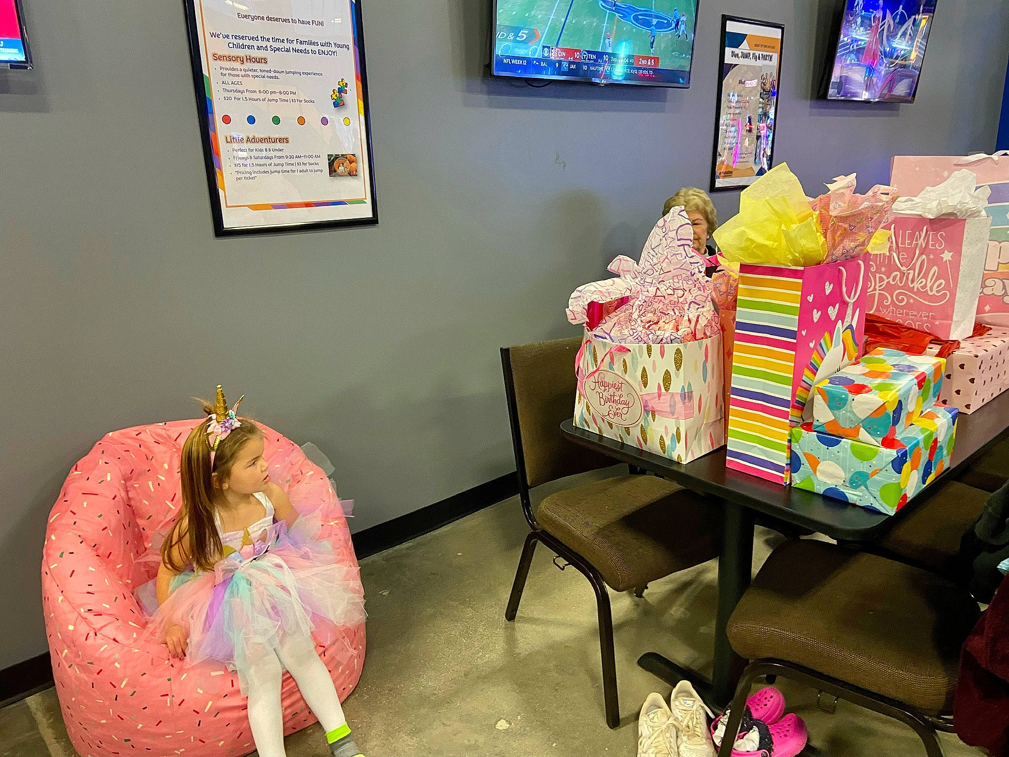 Paisley joined the competition — help win amazing prizes! bag, child, comfort, display_device, event, flooring, furniture, interior_design, leisure, linens, luggage_and_bags, magenta, person, picture_frame, pink, room, shelving, stuffed_toy, table, textile