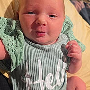 Simbalina joined the competition — help win amazing prizes! baby, infant, newborn, portrait, close_up, face, onesie, clothing, blanket, bedding, hand, finger, skin, expression, indoors, wood_floor, textile, soft_light, lying_down, smile