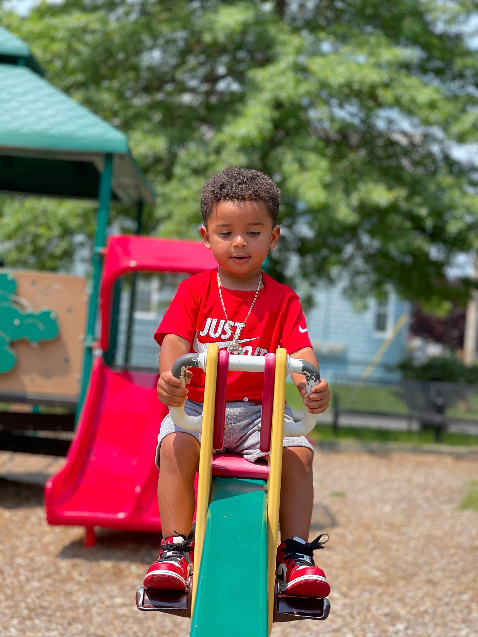 Yehezquiel joined the competition — help win amazing prizes! child, chute, city, fun, grass, happy, leisure, outdoor_play_equipment, outdoor_recreation, person, plant, play, playground, playground_slide, recreation, shorts, sitting, street_fashion, toddler, travel