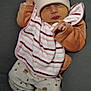 baby, sleeping, hat, bib, striped, cozy, clothing, infant, cute, soft, cushion, blanket, relaxed, peaceful, indoors, newborn, child, pajamas, pink, warm