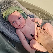 Eliana is registered to the contest to win money with this photo: baby, bath, water, toddler, child, hand, tattoo, washcloth, mesh, bathseat, skin, nail_polish, support, infant, relaxing, indoor, bathroom, person, cute, playful